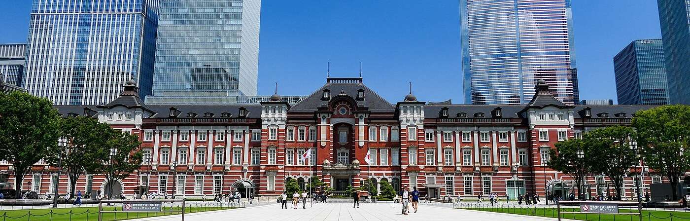 The red-brick Marunouchi facade of Tokyo Station, home of the Tokyo Station Hotel, lit at dusk